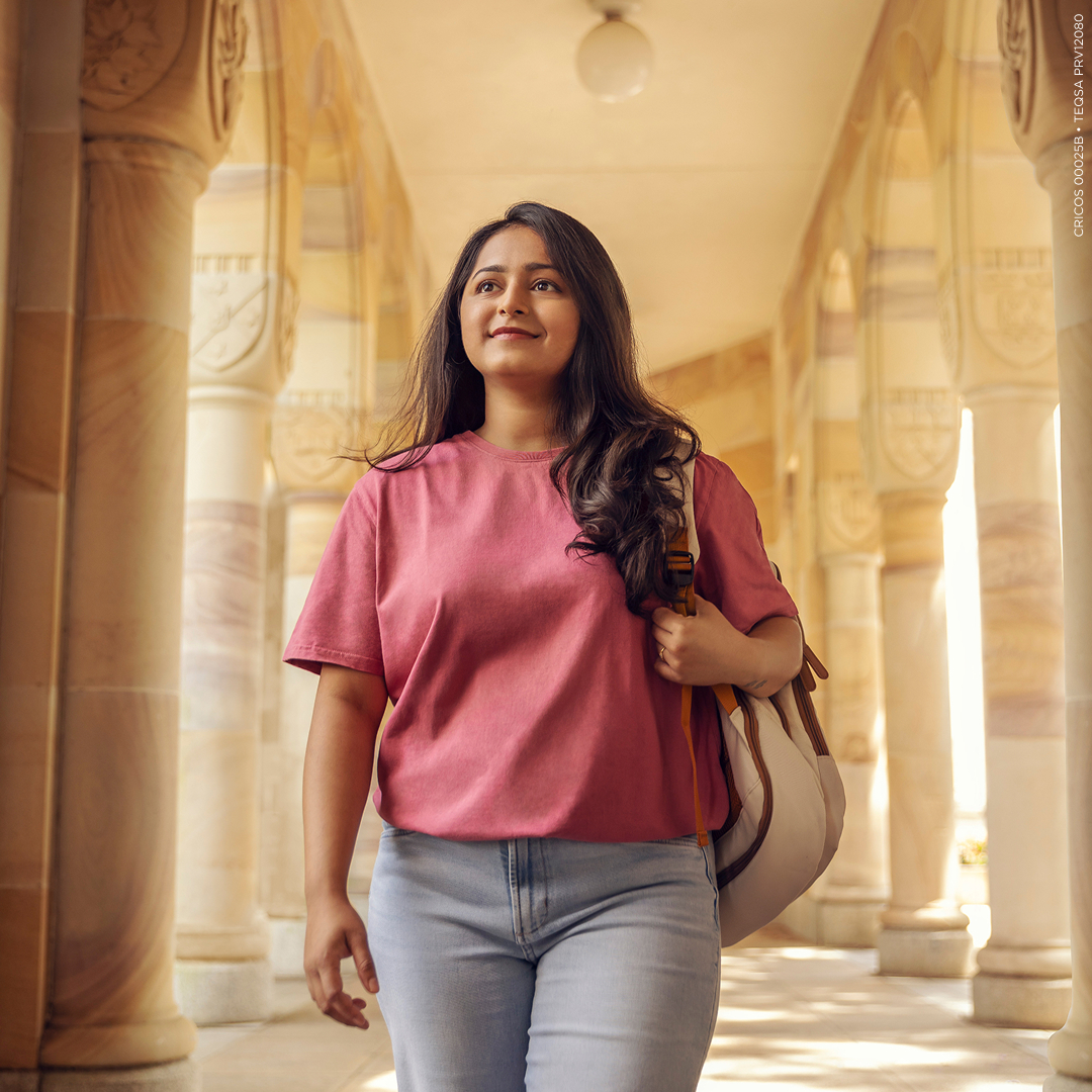 female walking through the cloisters